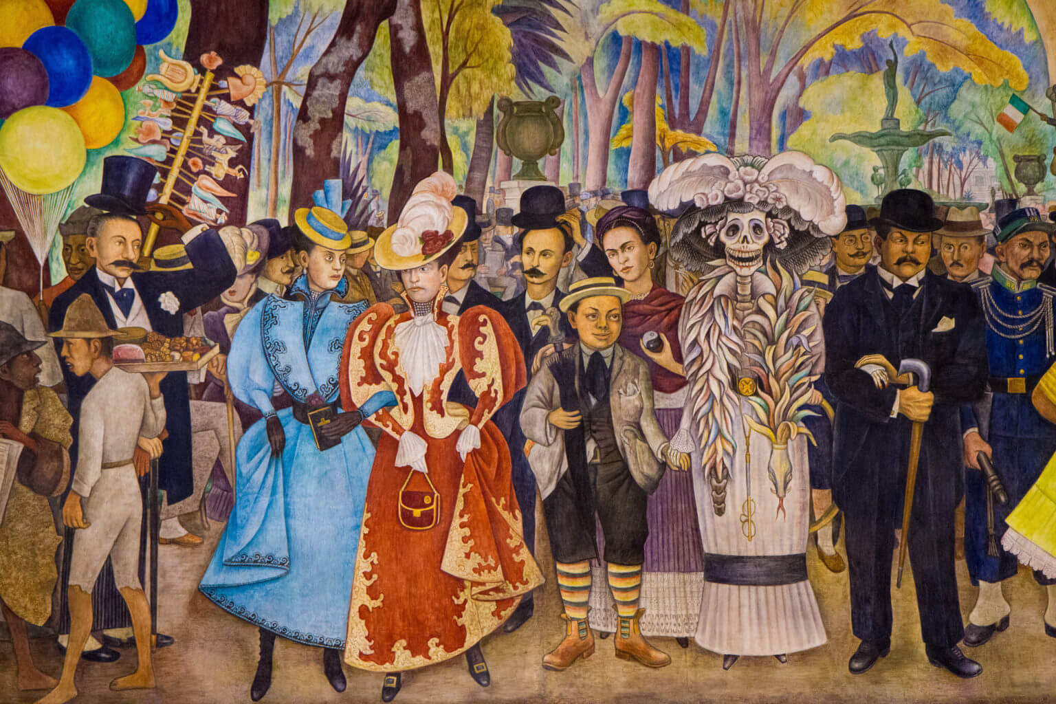 Mural by Diago Rivera features La Calavera Catrina, Diago Rivera as a boy, and his wife Frida Kahlo.