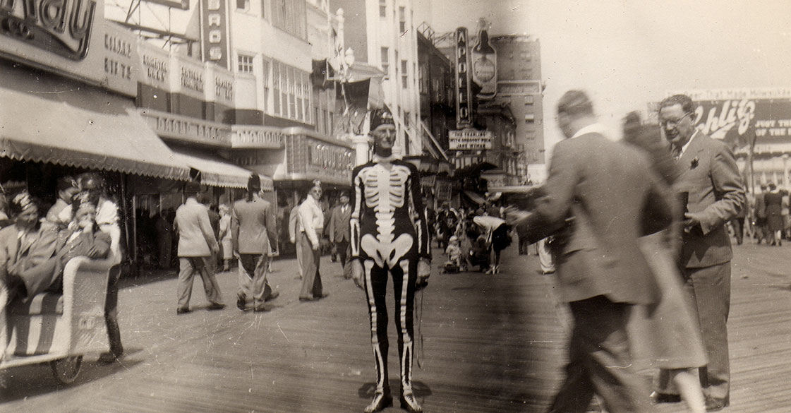 Haunted Air Book Vintage Halloween Photos - Man in Skeleton Costume in Busy Street